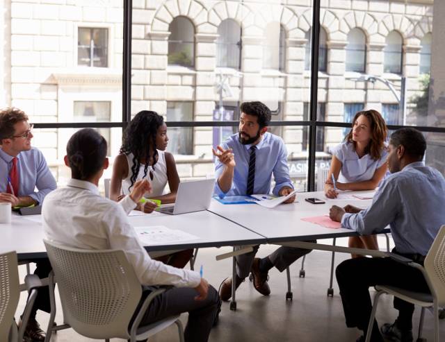 Corporate business team and manager in a meeting, close up